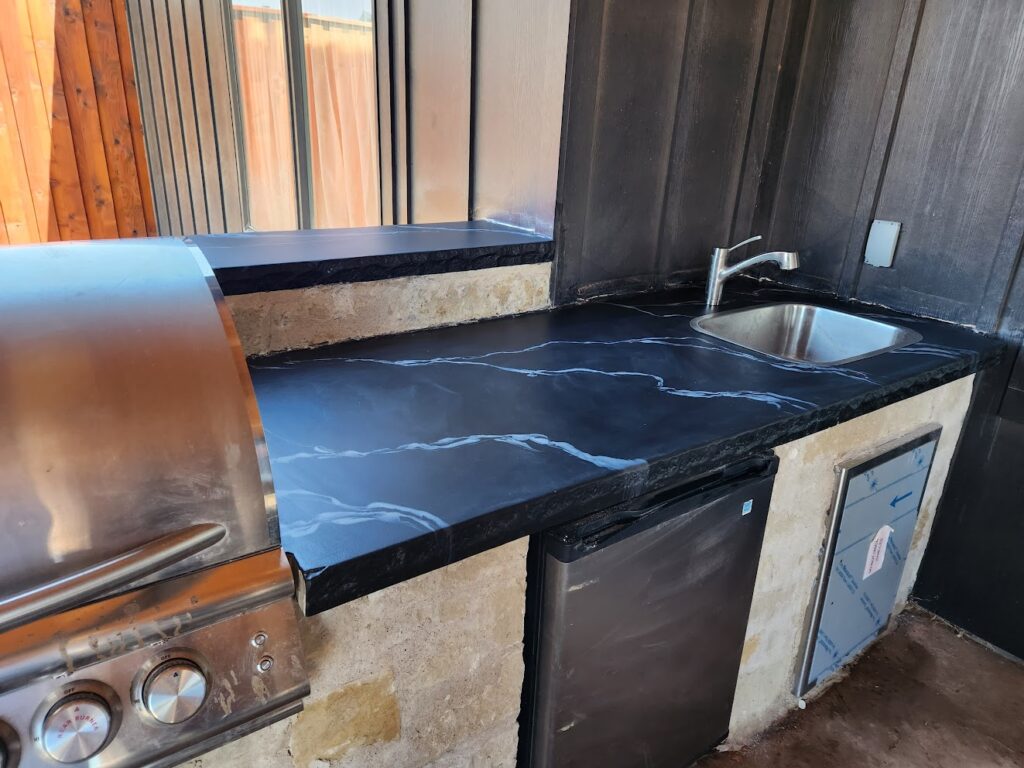 Patio Outdoor Kitchens with Black Epoxy Decorative Coatings in Lubbock TX